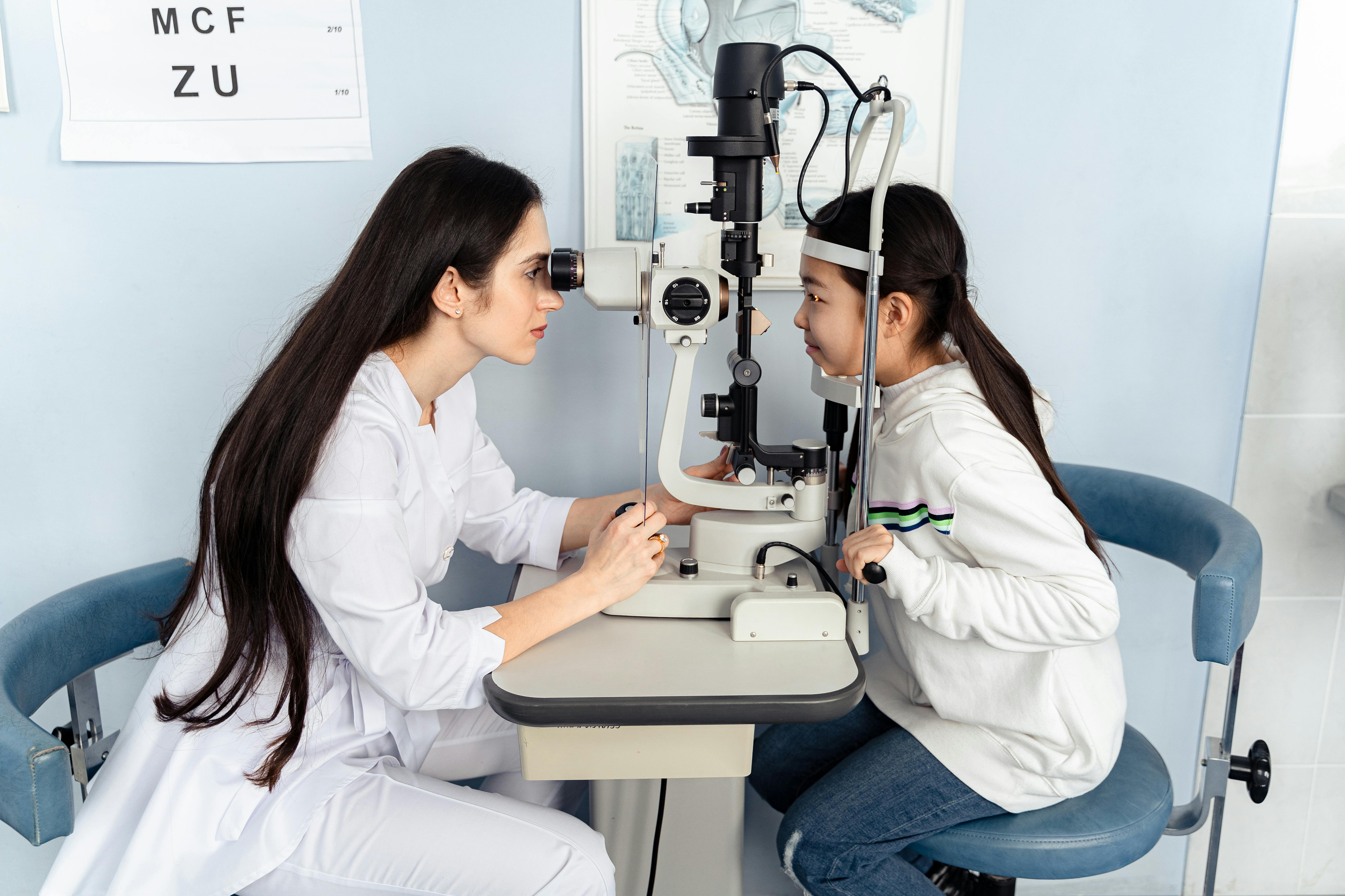 Doctor examining a patient's eyes at Drikveda Eye Hospital